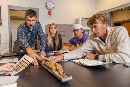 Students looking at soils