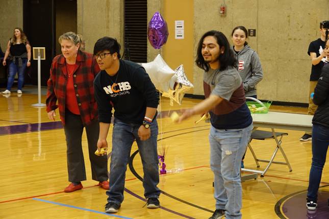 Teams chuck chickens into buckets as part of the Spirit Sprint Relay Challenge