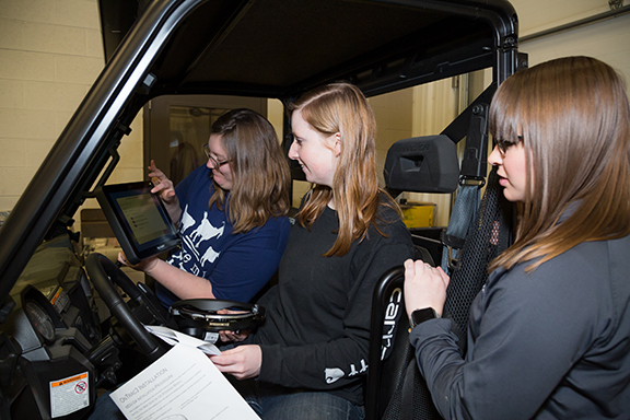 girls in a tractor cab girls in a tractor cab