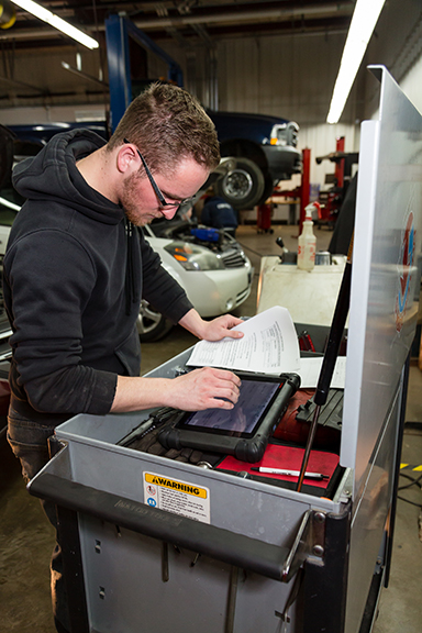 student working in the automotive shop