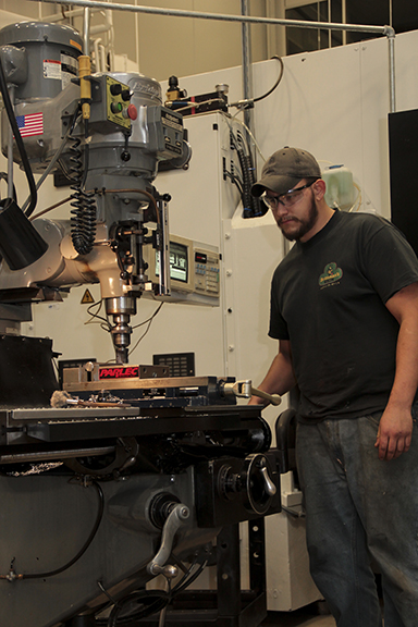 student working on machine student working on machine