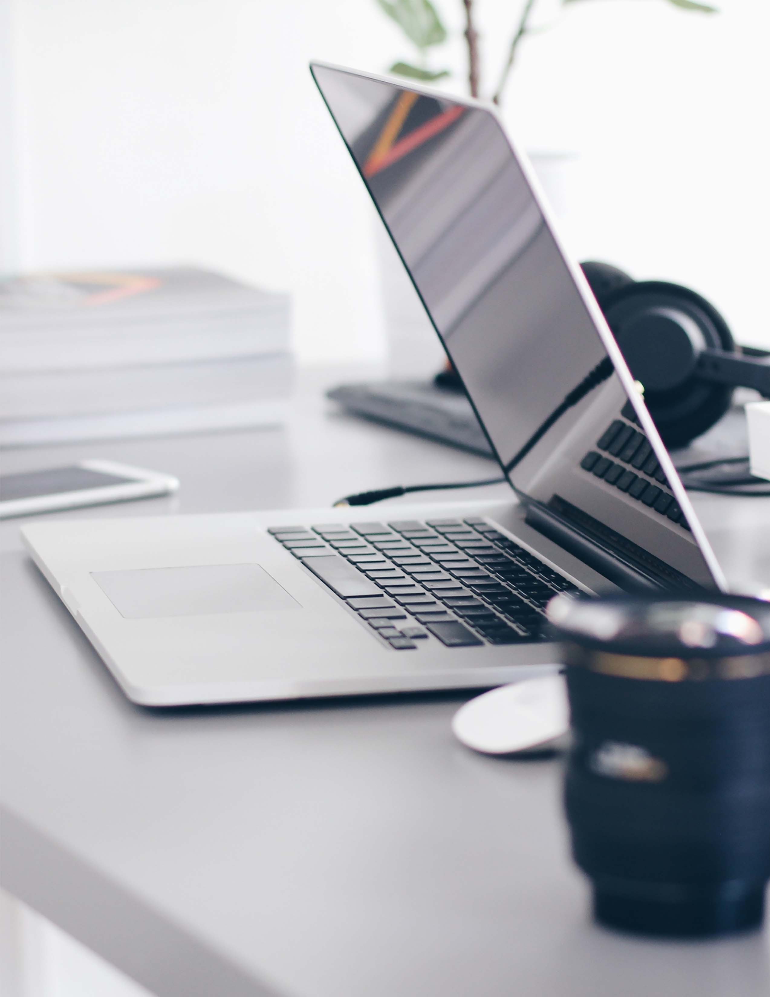 Laptop on desk with coffee mug